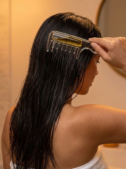 Scalp applicator comb in use
